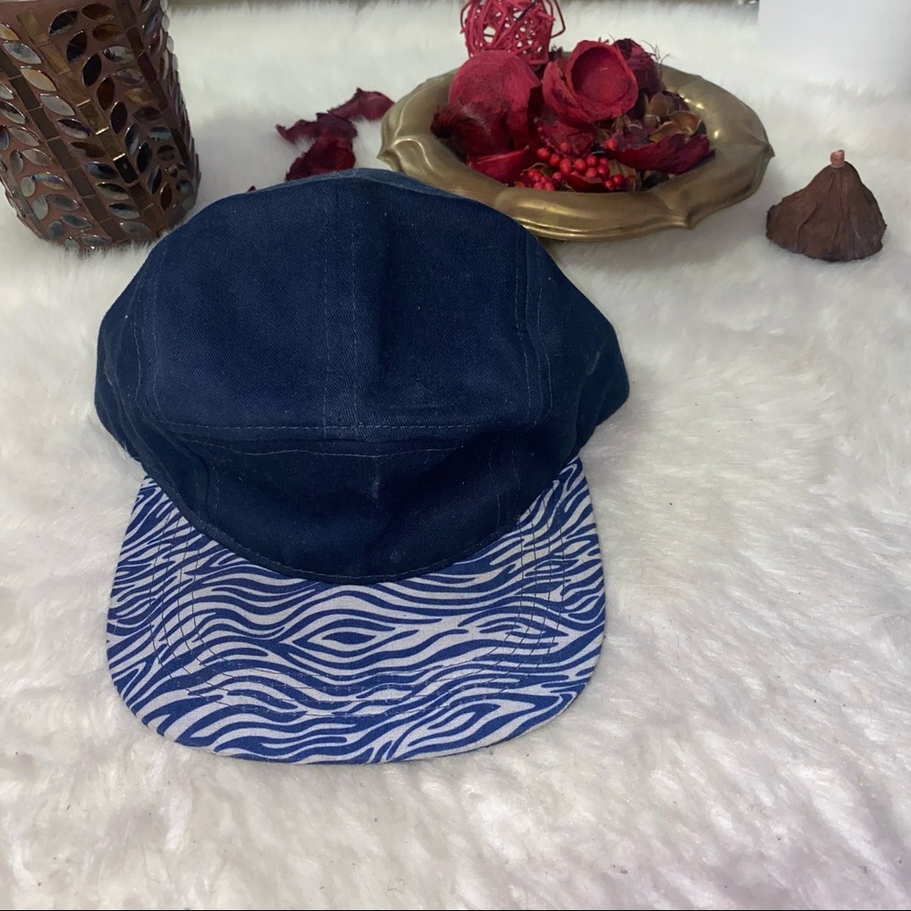 Call It Spring Men’s snap back blue & white animal print💙